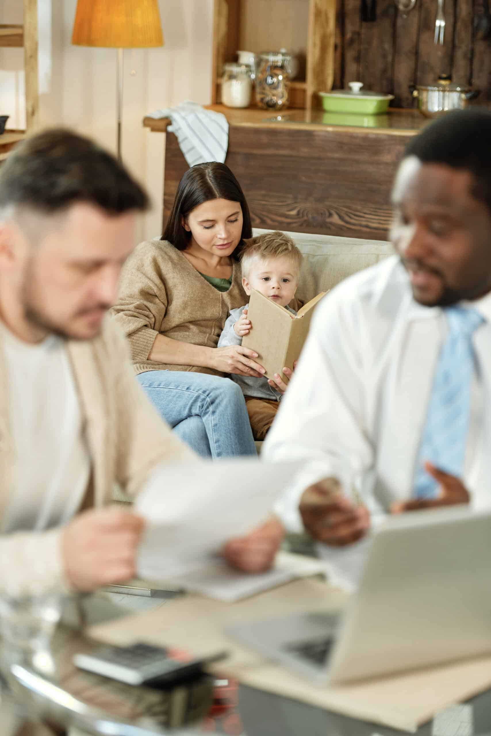woman with son reading on sofa scaled
