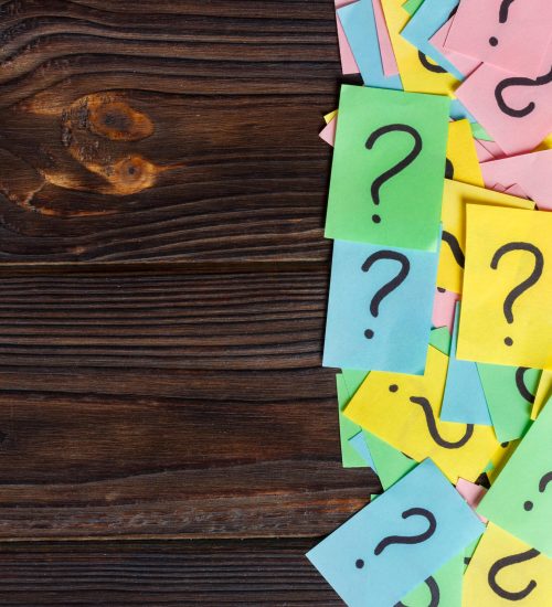 colorful question marks background written reminders tickets. ask or business concept with copy space.