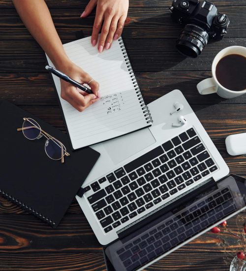 Young female freelancer working indoors in the office at daytime.